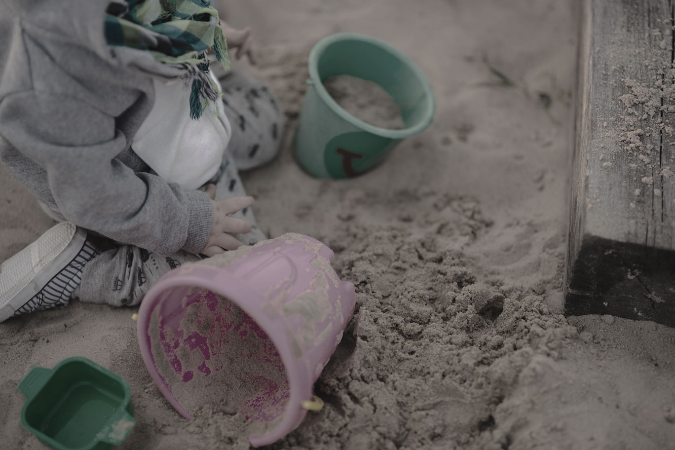 Child Playing in Sandbox
